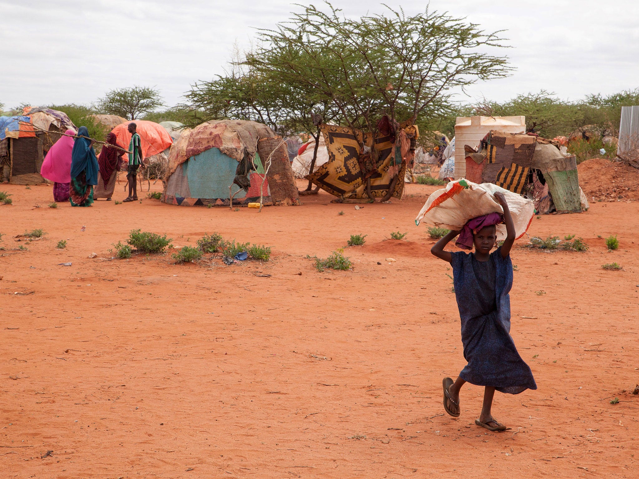 A child carrying a bag in a displaced persons camp due to Ethiopia's drought in Wender on 9 June 2017