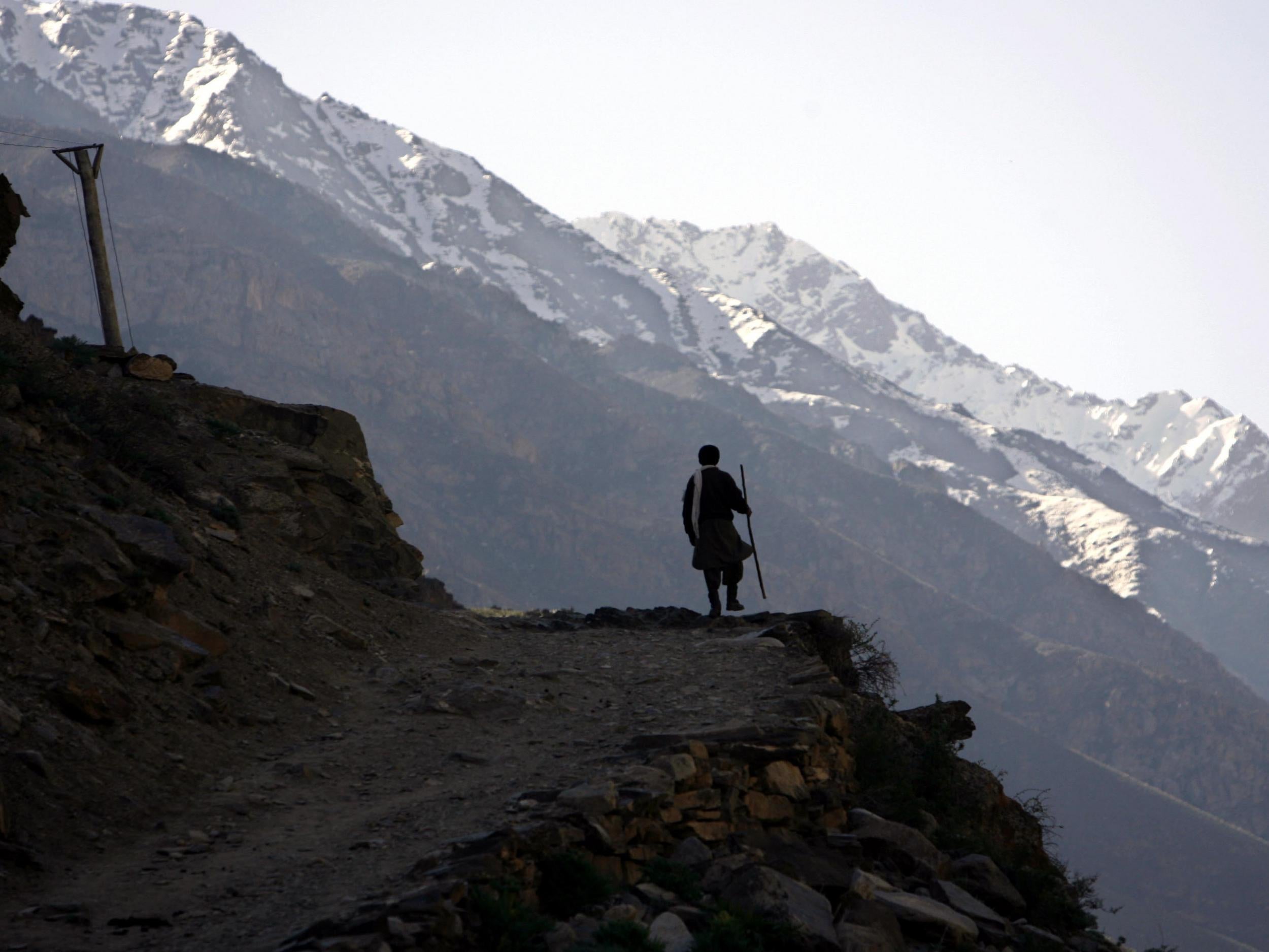 An Afghan miner walks up to the emerald mines in the mountains of the Panjshir Valley, north of Kabul