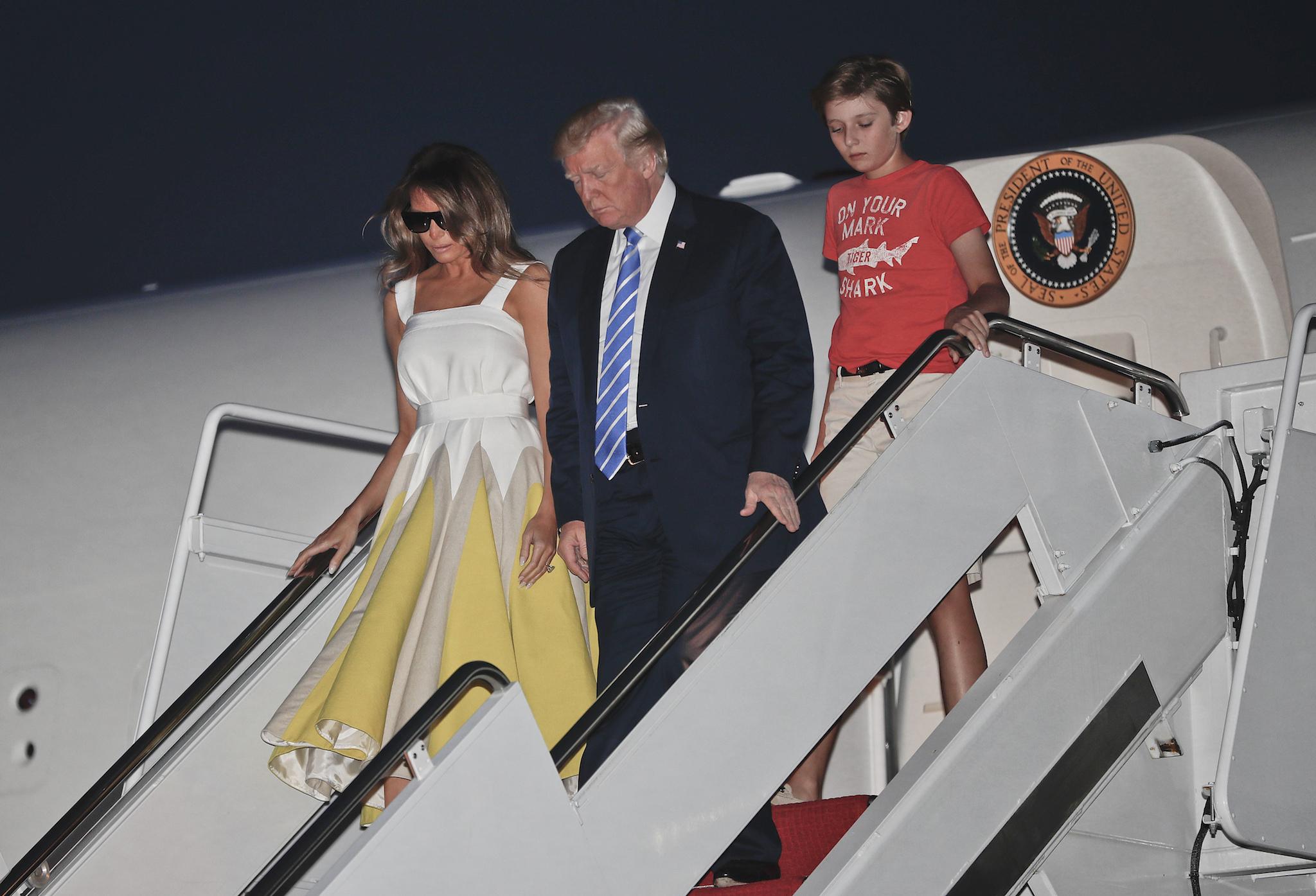 The US President arrived at Andrews Air Force Base, Maryland with first lady Melania Trump and son Barron Trump yesterday