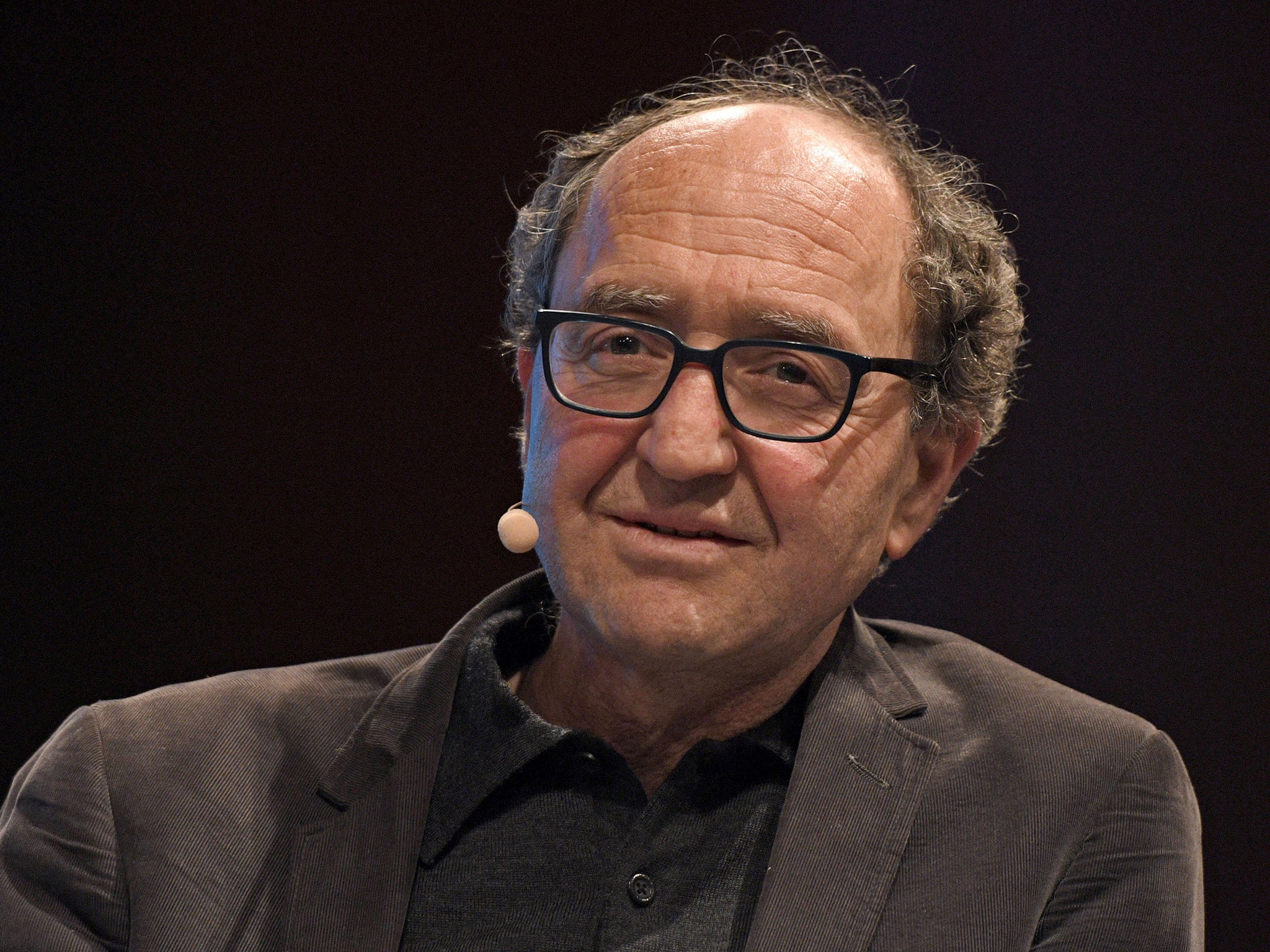 German author of Turkish origin Dogan Akhanli pictured taking part in a panel discussion during a literature festival in Cologne in March. He was arrested in Spain on 19 August on the request of the Turkish government.