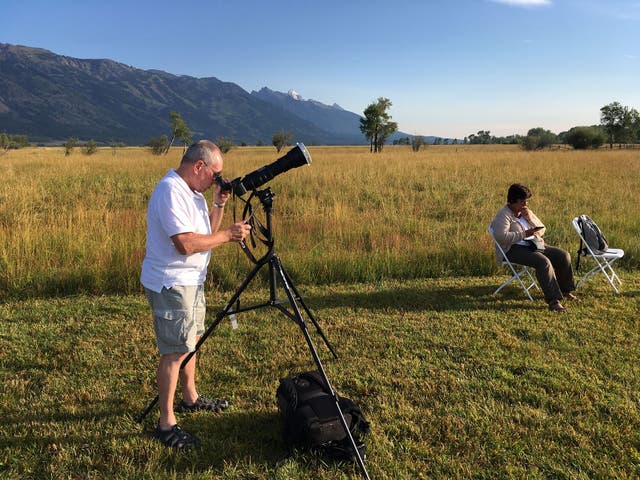 <p>Tourists make the most of the clear skies to watch the 2017 solar eclipse near Jackson, Wyoming</p>