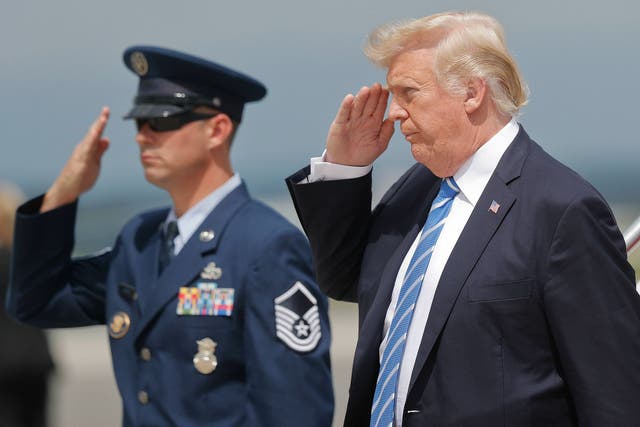President Donald Trump returns a salute at Hagerstown Regional Airport in Hagerstown, Maryland, on Friday, Aug. 18, 2017.
