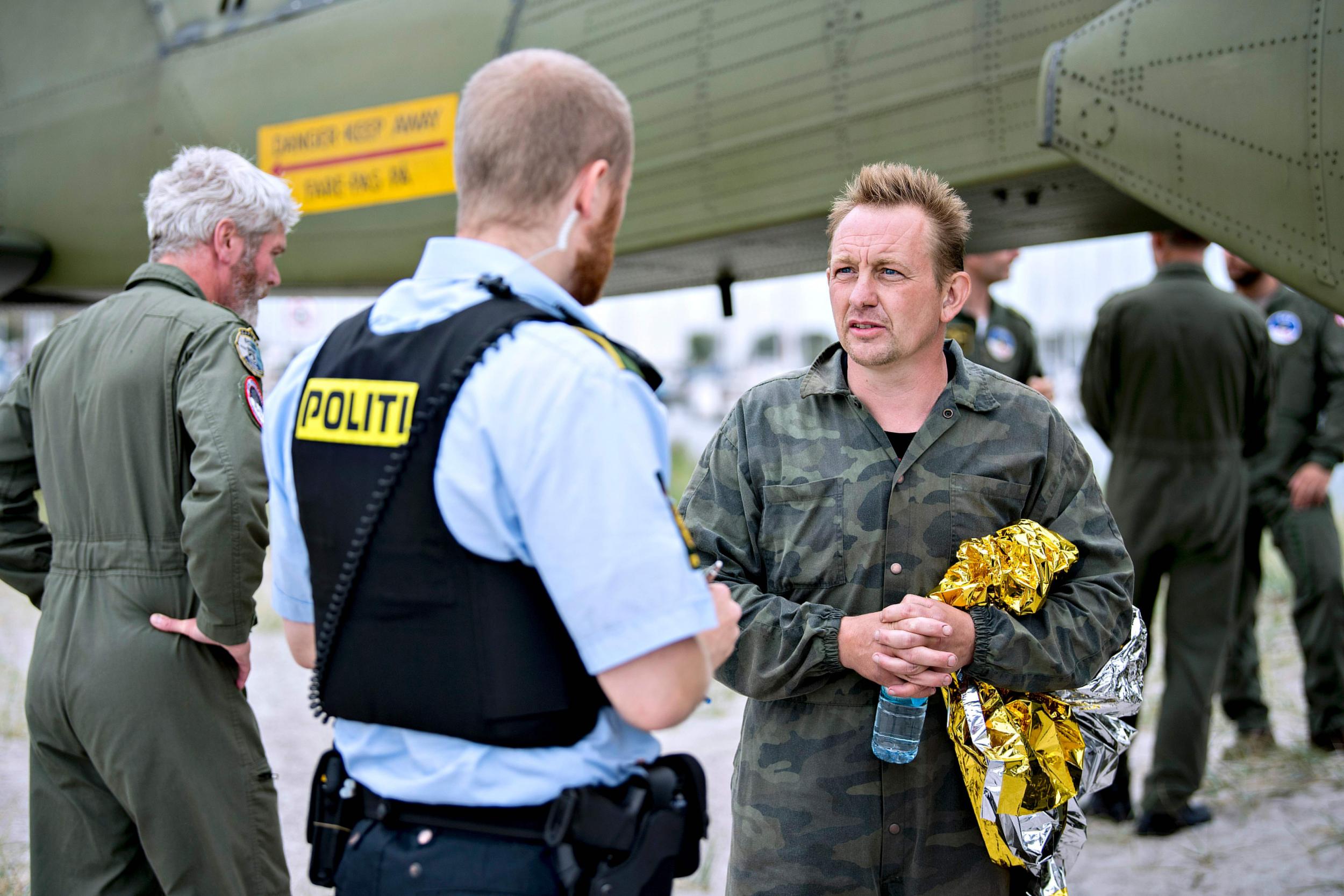 Peter Madsen speaks to an officer following his rescue in August, 10 days before Kim Wall’s body was found