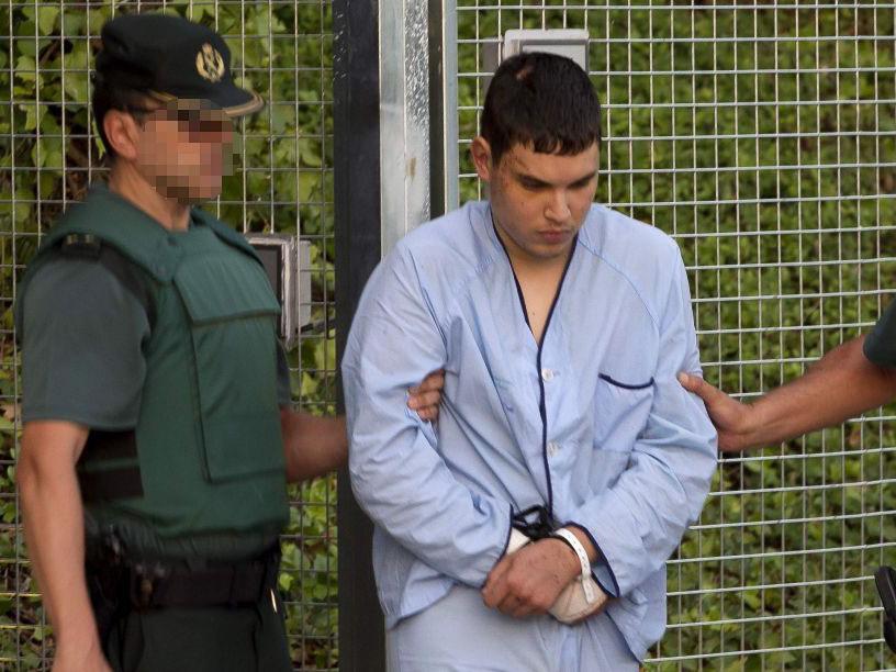 Mohamed Houli Chemlal, suspected of involvement in the terror cell that carried out twin attacks in Spain, is escorted by Spanish Civil Guards to court