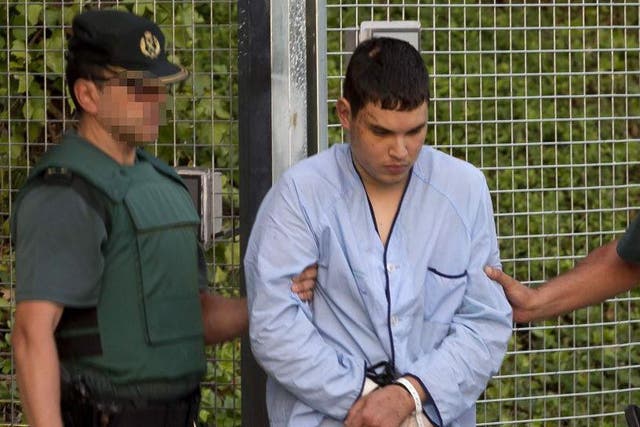Mohamed Houli Chemlal, suspected of involvement in the terror cell that carried out twin attacks in Spain, is escorted by Spanish Civil Guards to court