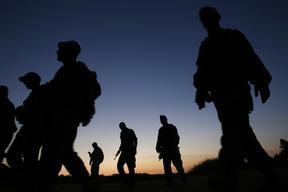Israeli Defence Force soldiers take part in a night-time tracking drill in southern Israel