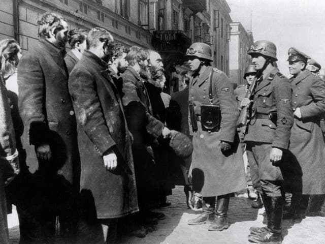 Nazi soldiers questioning Jews after the Warsaw Ghetto Uprising in 1943. Black Ribbon Day is commemorated to remember the victims of Nazism and Stalinism