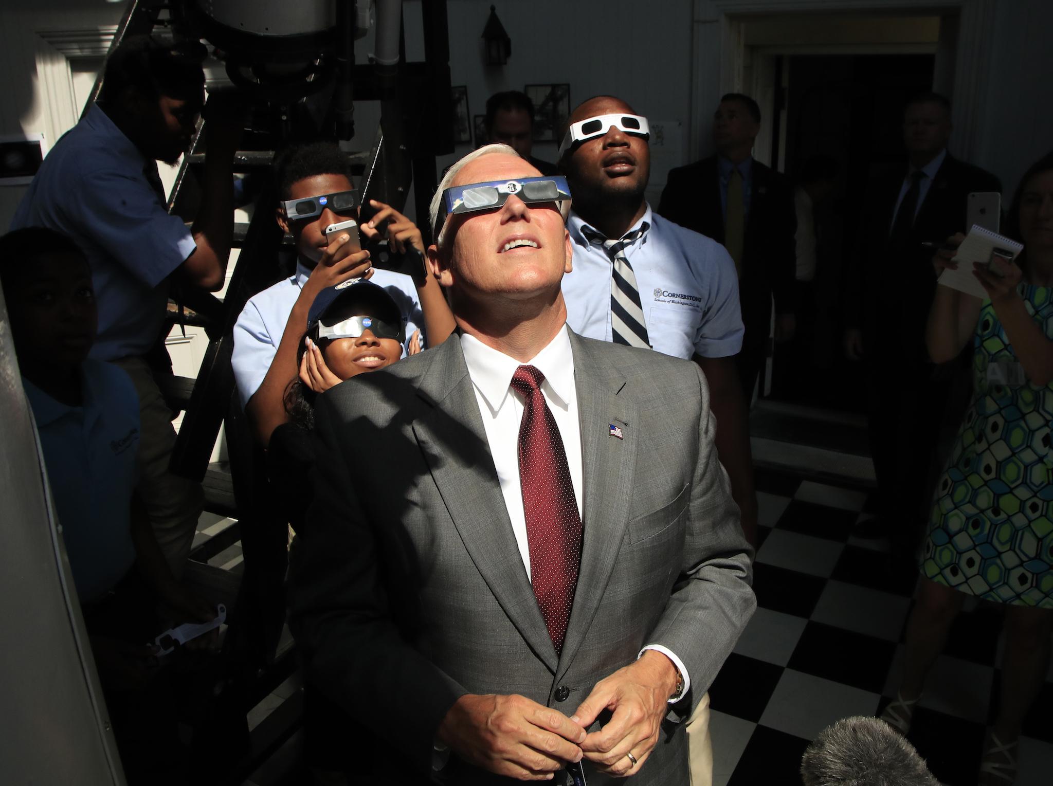 Vice President Mike Pence with students from Cornerstone Schools watches the great American solar eclipse at the US Naval Observatory in Washington