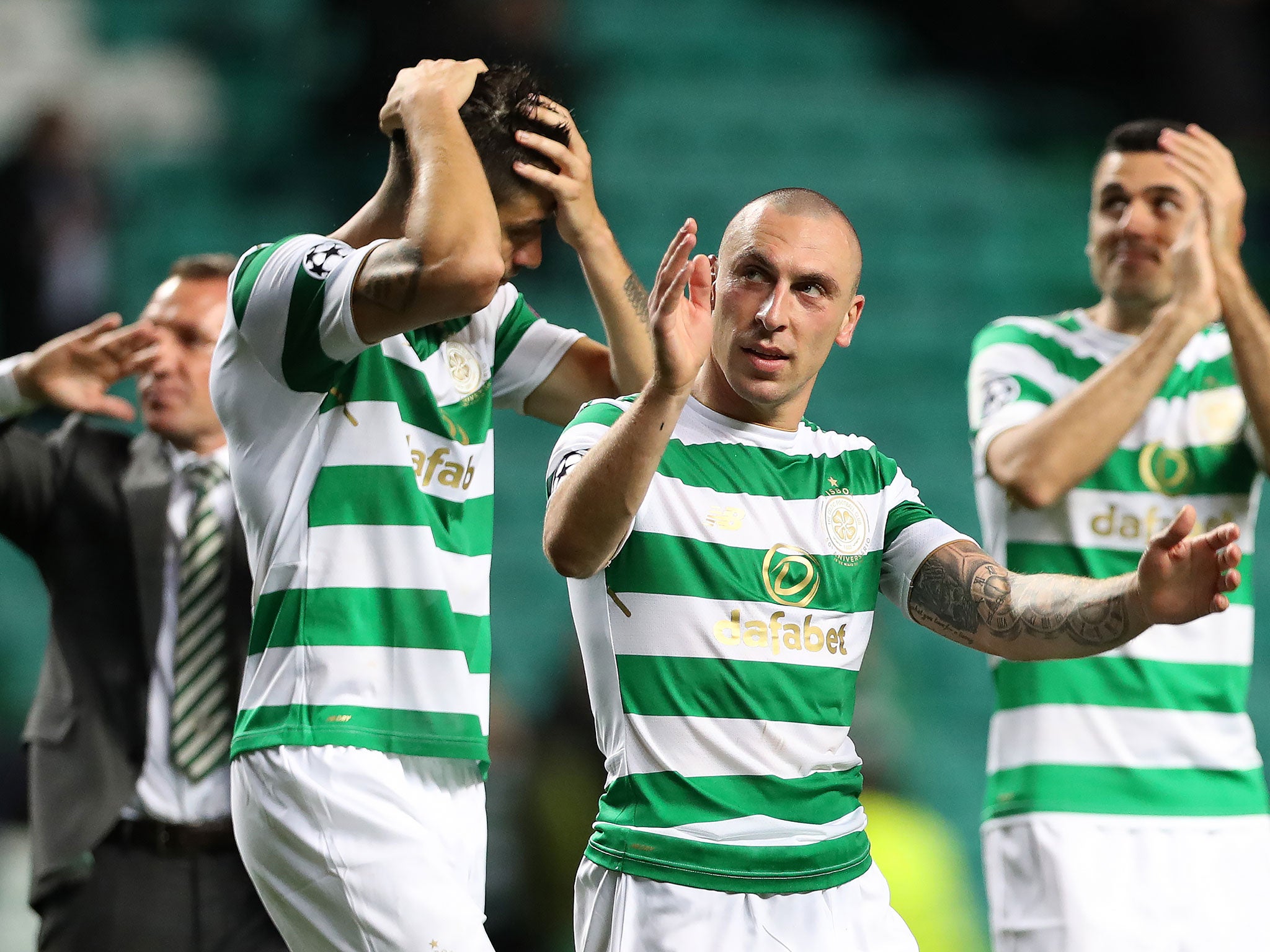 Celtic's players celebrate after securing their place in the Champions League group stages