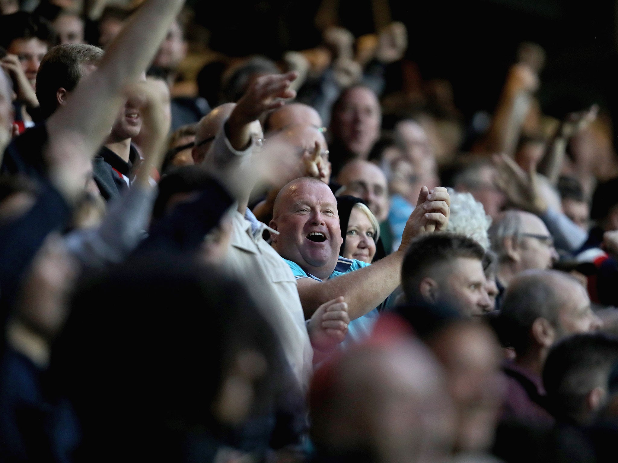 Brentford fans celebrate after Ariel Borysiuk scored the visitors' opener