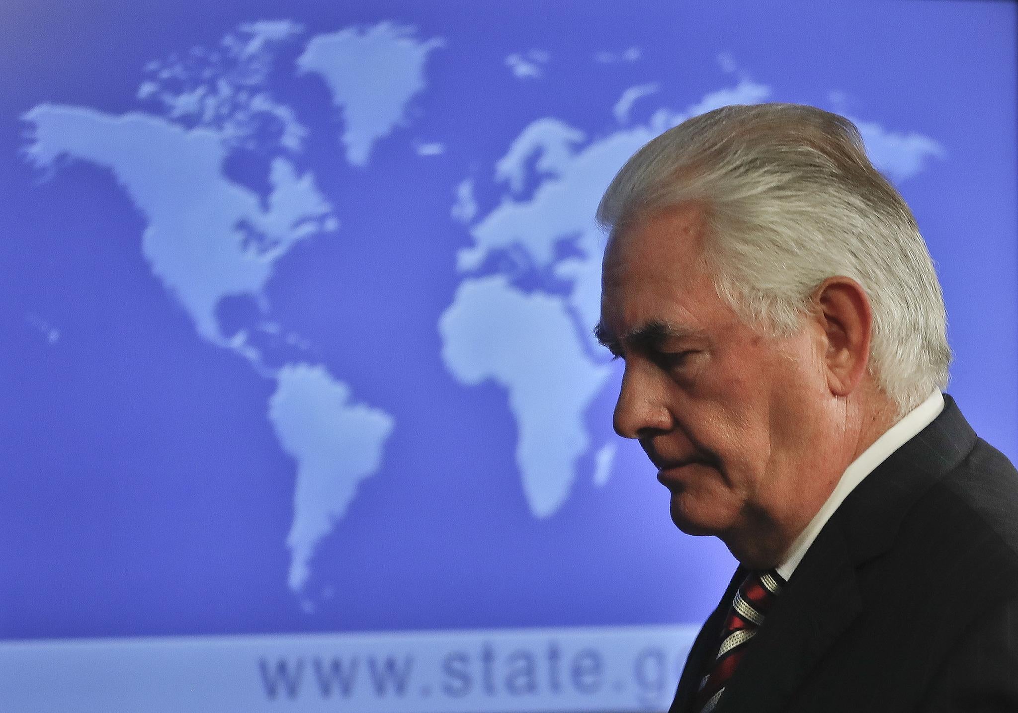 Secretary of State Rex Tillerson leaves after speaking at the State Department