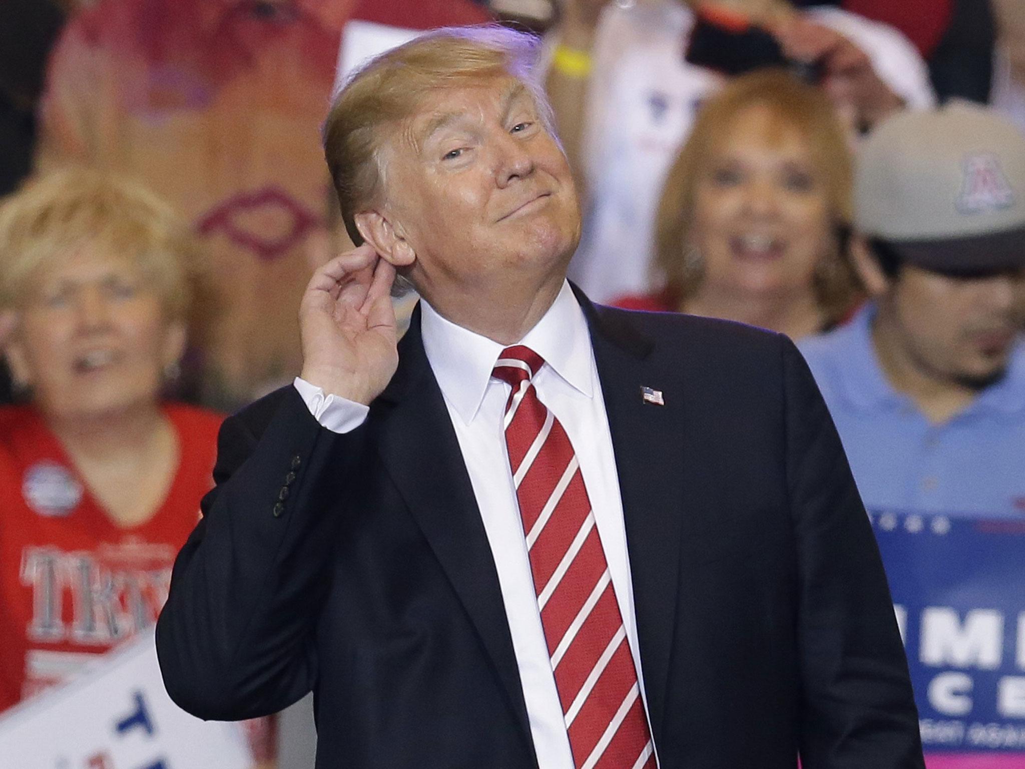 Mr Trump revved up supporters at the Phoenix Convention Center with a defence of his response to a white supremacist-organised rally in Virginia