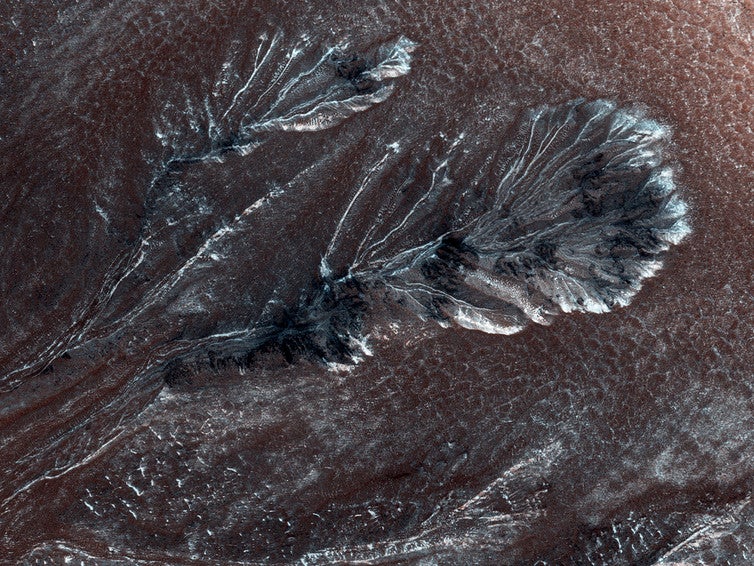 Seasonal frost (or snowfall?) in gullies on a crater wall on Mars, at 60⁰ N. This view is about 800 metres wide