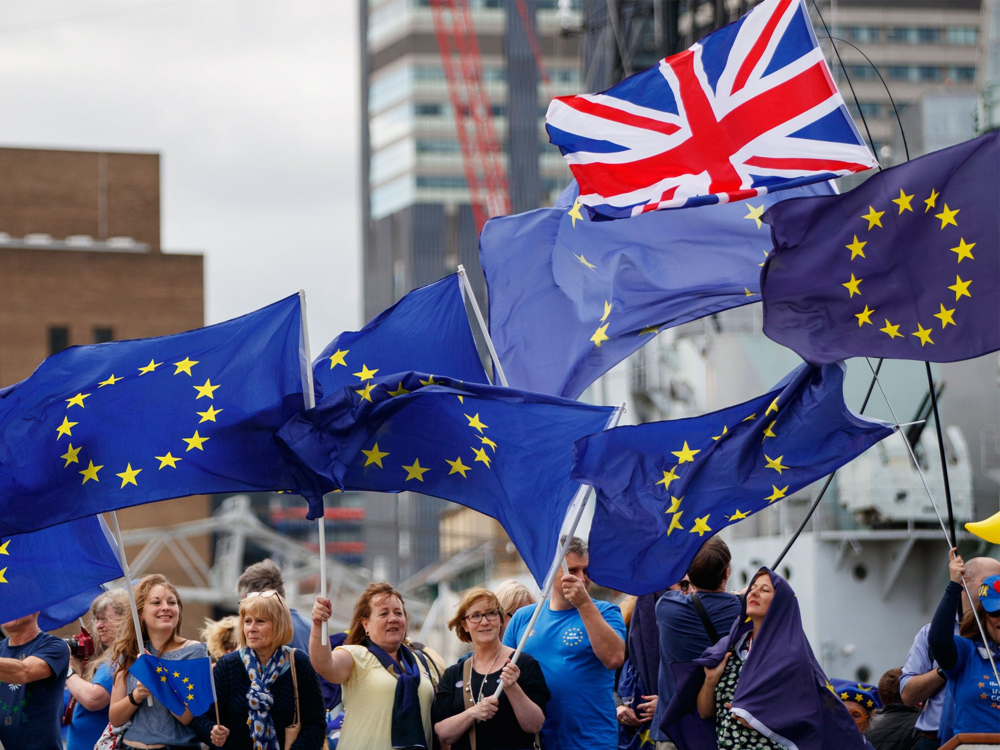 Anti-Brexit campaign group 'The No 10 Vigil' sail a boat bedecked with EU flags up the River Thames