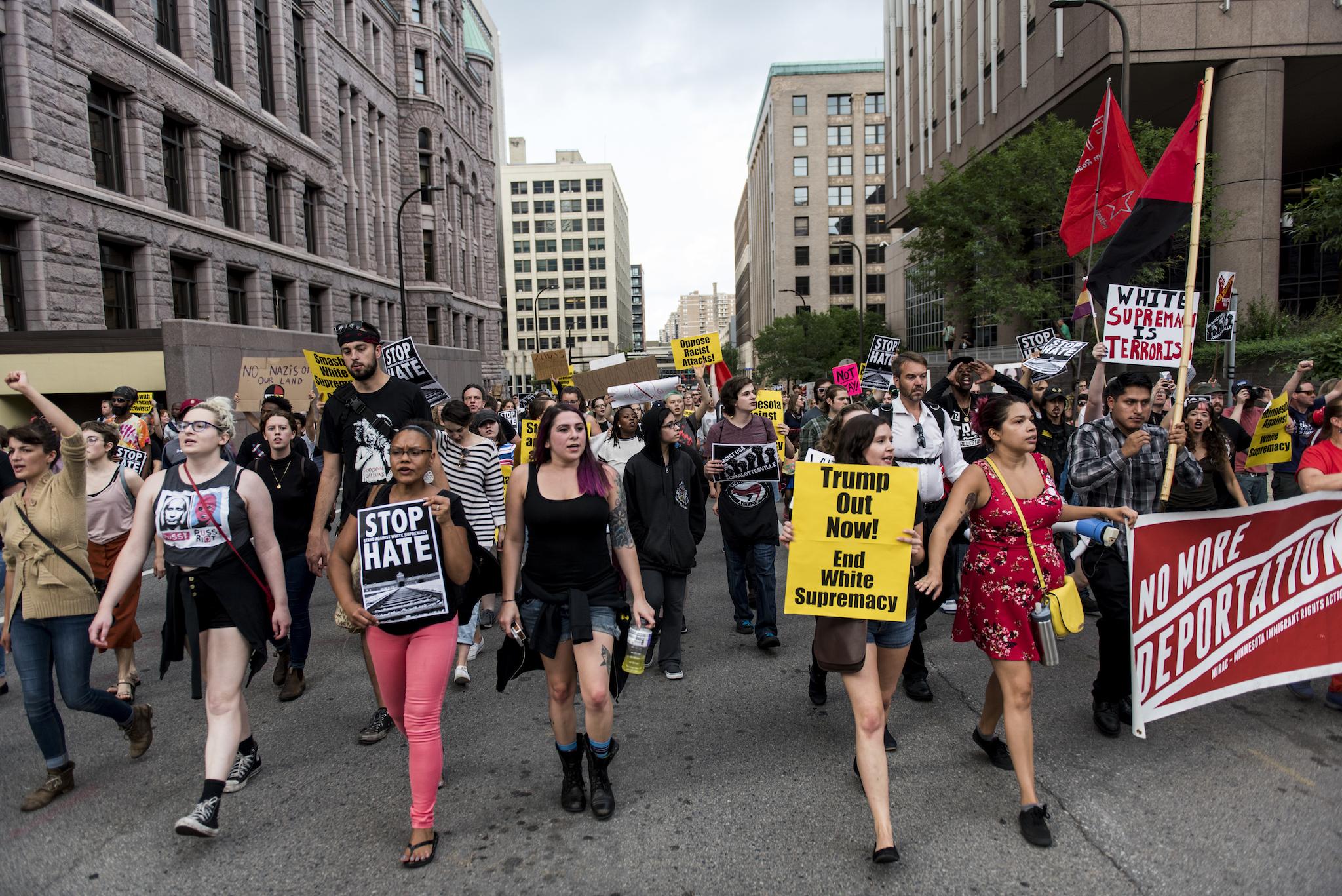People march in downtown Minneapolis to protest racism and the violence in Charlottesville