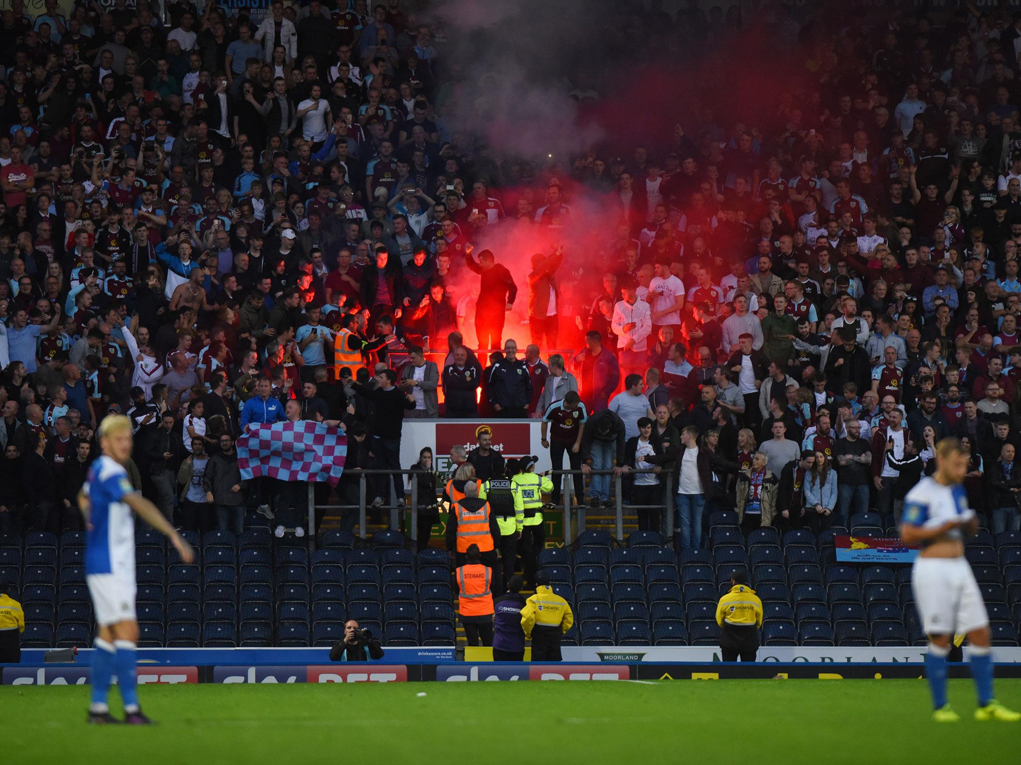 The Burnley fan who let off a flare in the away end was also arrested