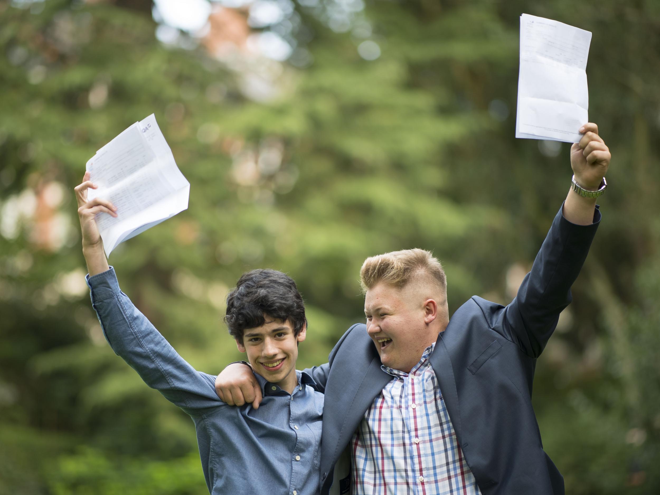 Matthew Lawrence (left) and Scott Jenkins celebrate after receiving their GCSE results at Ffynone House School in Swansea