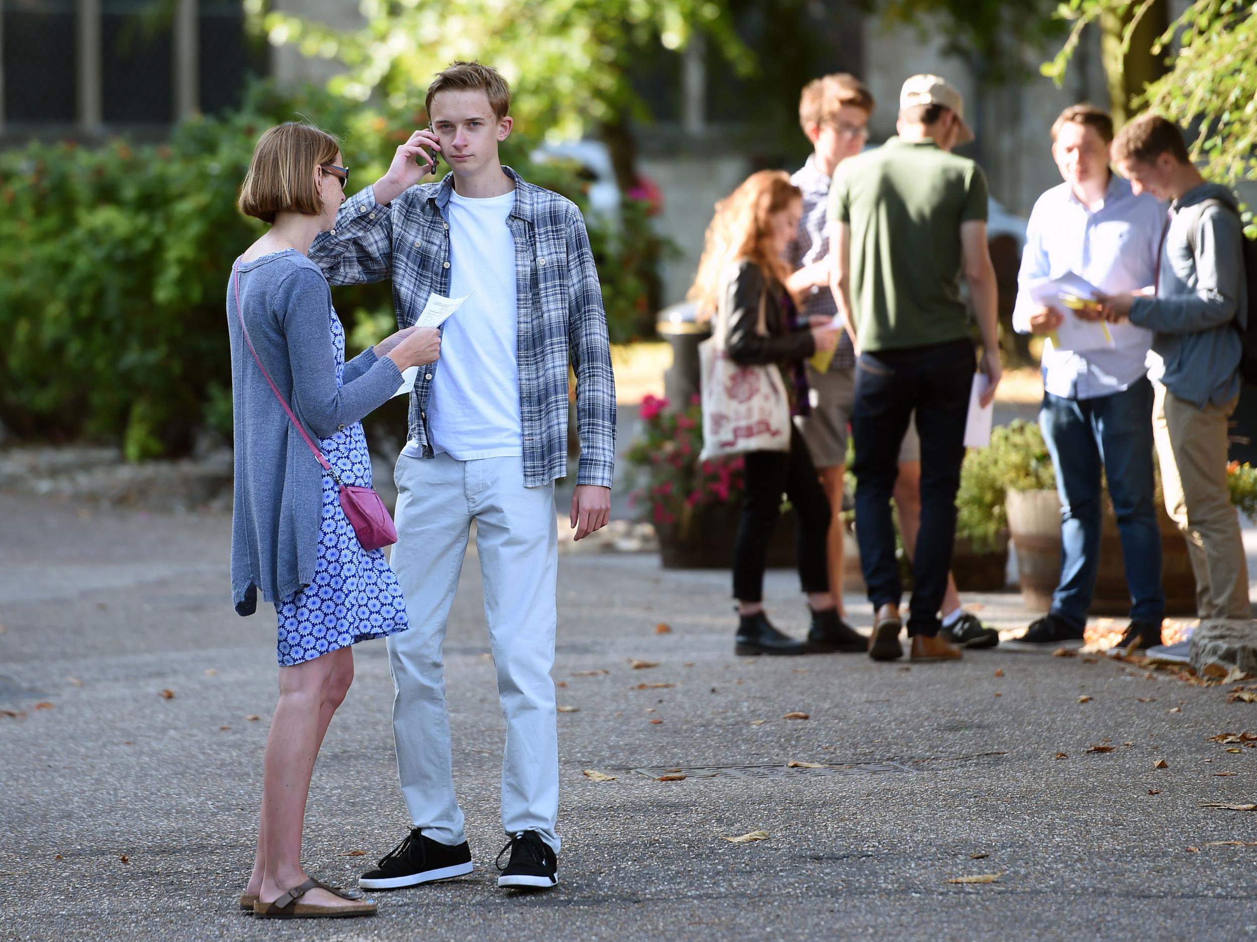 William Walton makes a phone call after collecting his GCSE results at Norwich School
