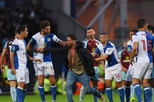 Five were arrested at Blackburn after fans invaded the pitch and attacked players