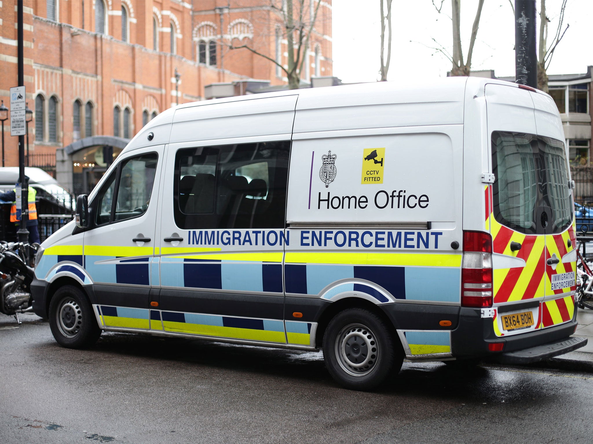 A Home Office immigration enforcement van parked in Westminster, London