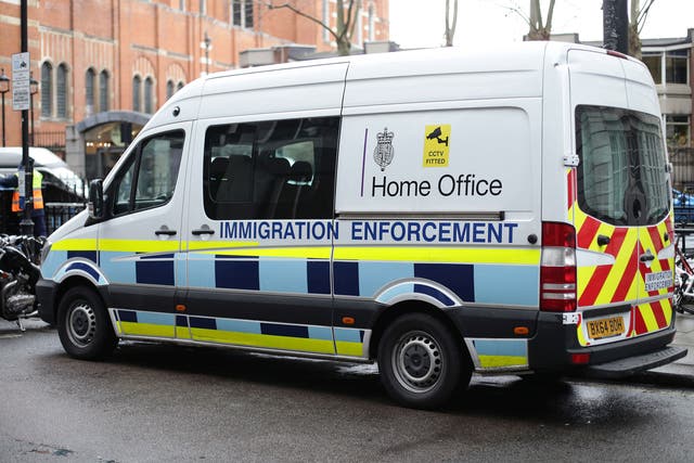 A Home Office immigration enforcement van parked in Westminster, London