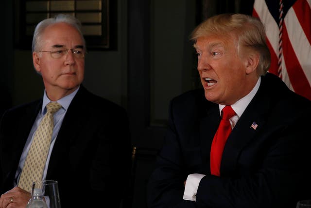 Donald Trump, flanked by Secretary of Health and Human Services  Tom Price, at an opioid-related briefing  in Bedminster, New Jersey, August 8, 2017.