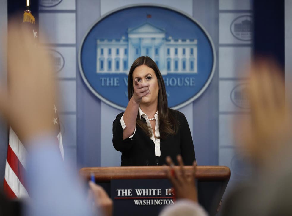 White House press secretary Sarah Huckabee Sanders points to a reporter during the daily news briefing at the White House