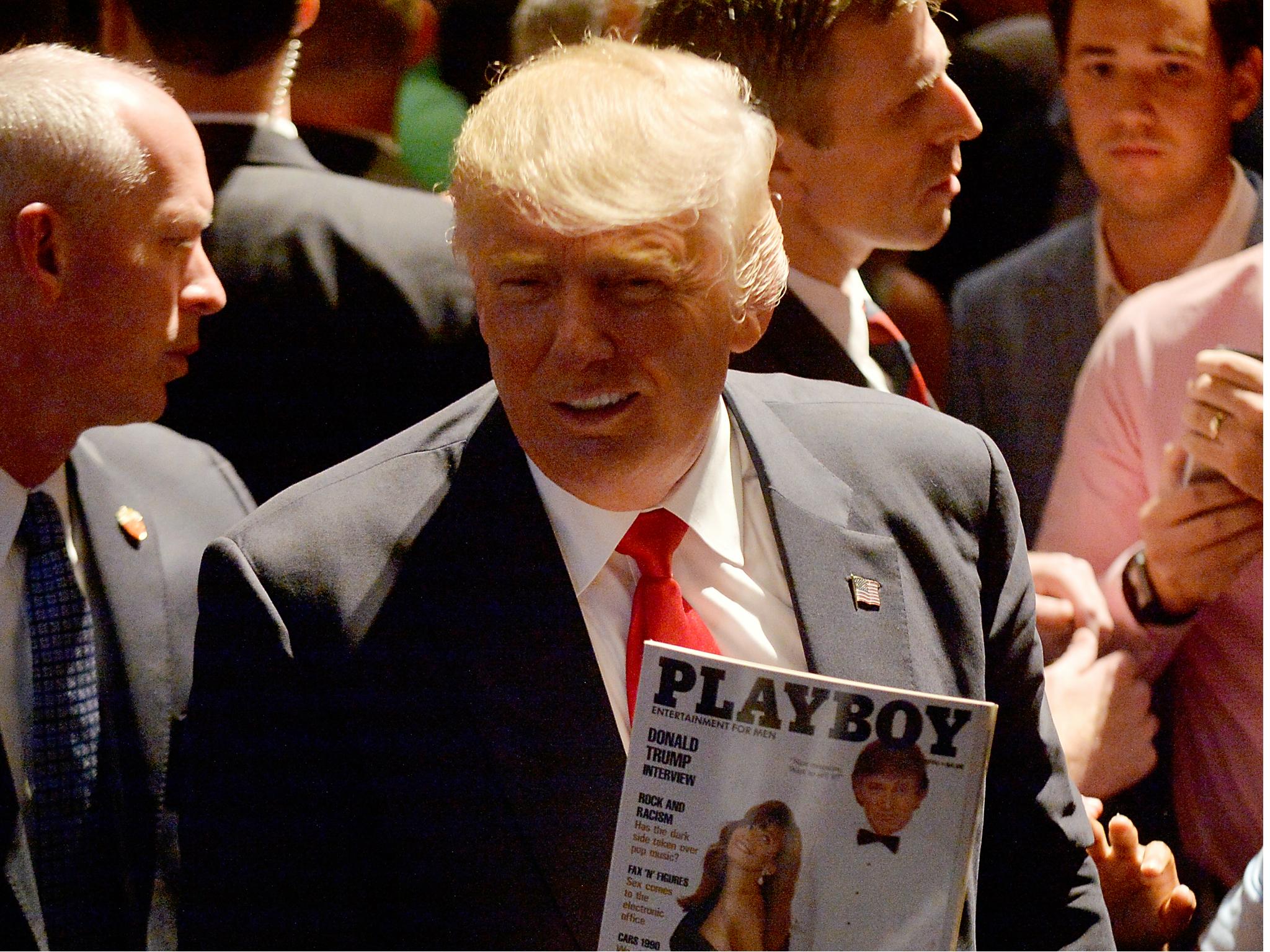 Donald Trump holding a copy of his Playboy cover from March 1990 on the campaign trail in North Carolina on 5 July 2016.
