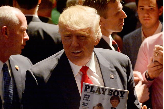 Donald Trump holding a copy of his Playboy cover from March 1990 on the campaign trail in North Carolina on 5 July 2016.