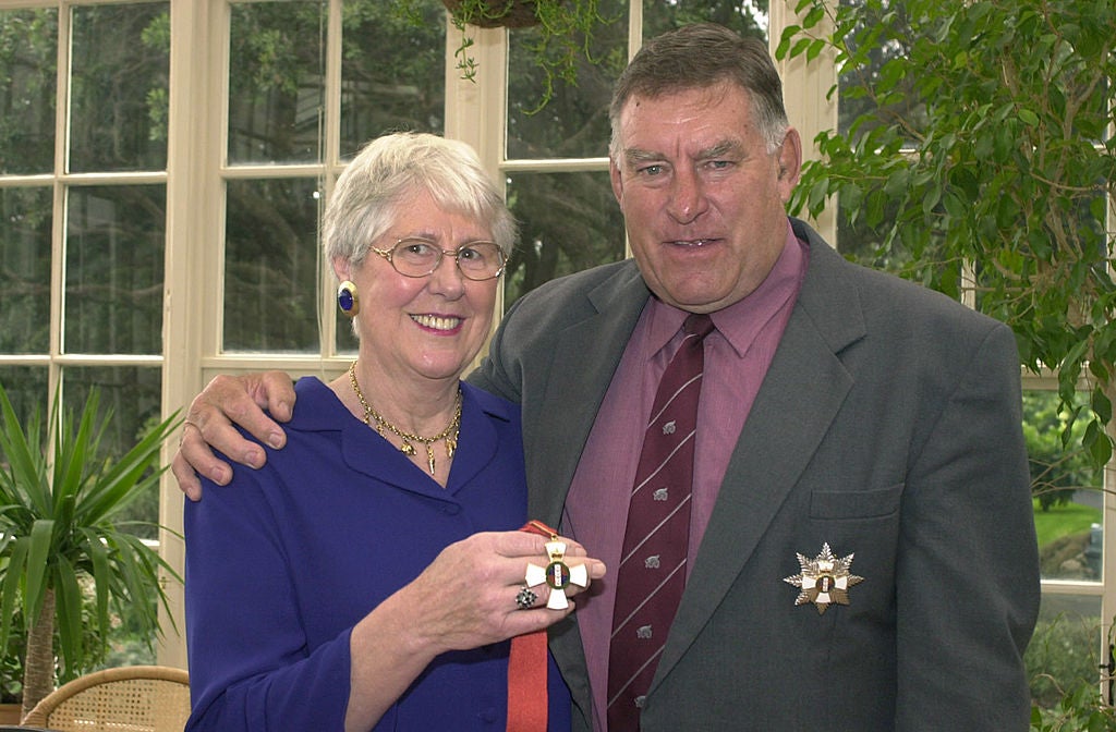 The All Black legend with his wife Verna in 2001, having been presented with the Distinguished Companion of the New Zealand Order of Merit