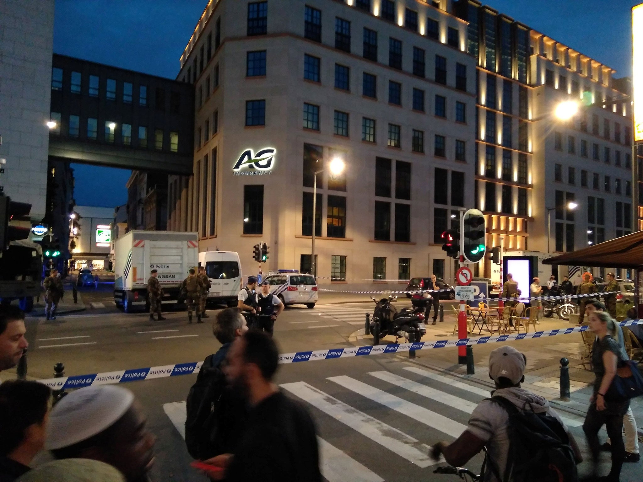 Belgian police and soldiers at the scene where a man attacked soldiers with a knife in Brussels on 25 August