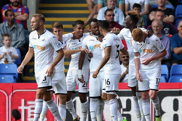 Swansea scored their first goals of the season to get their first win