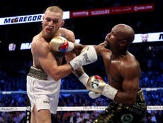 McGregor stopped by Mayweather despite valiant display