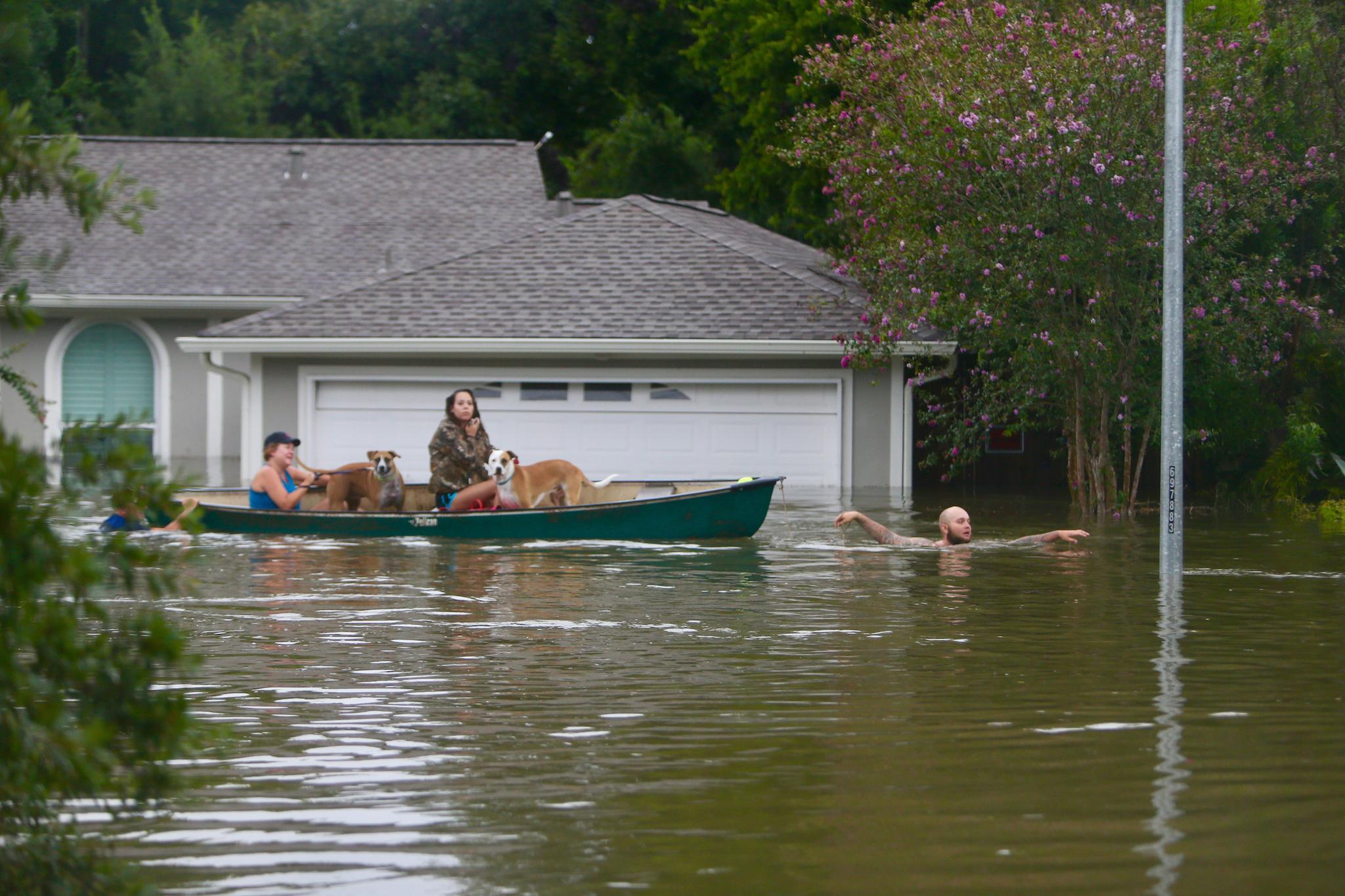 A family evacuates their Meyerland home near S. Braeswood