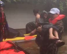 On board a rescue boat with volunteers saving families from Harvey