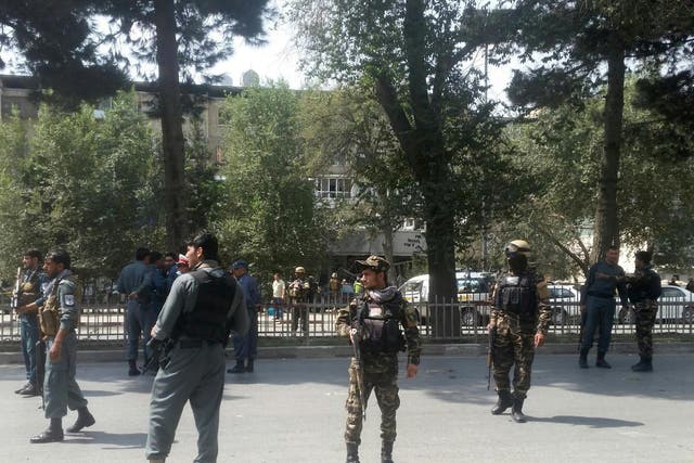 Afghan security forces keep watch at the site of attack in Kabul