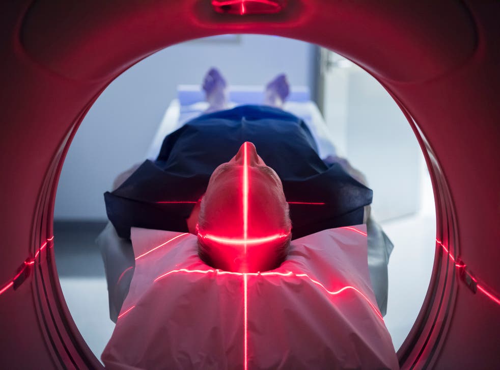 <p>Representational: Brain activity being monitored by an MRI machine</p>