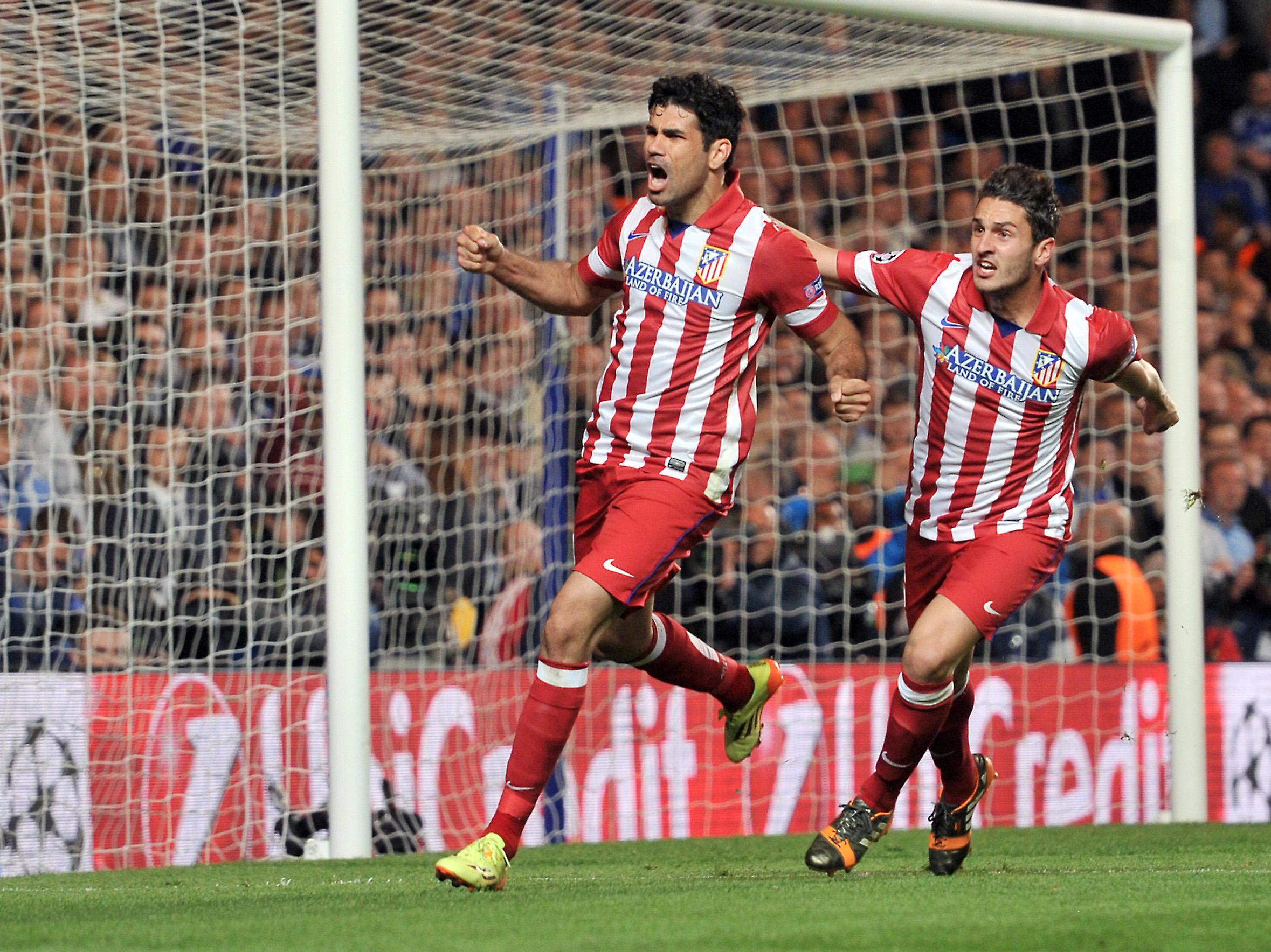 Diego Costa celebrates scoring for Atletico Madrid against Chelsea in 2014, with former teammate Koke