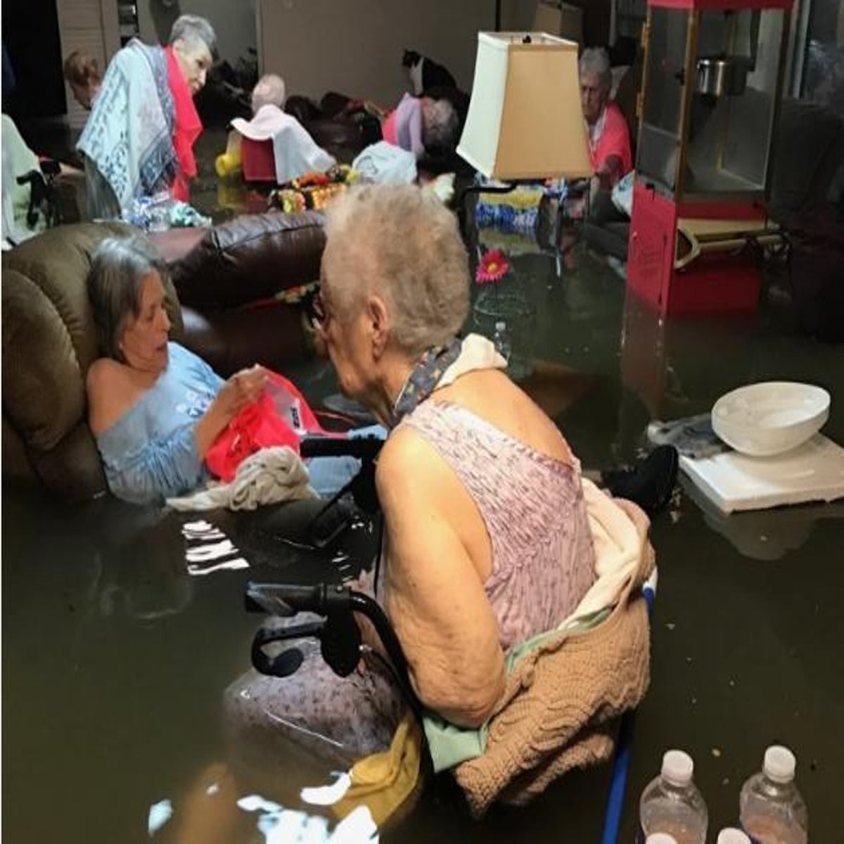 Hurricane Harvey: Viral picture of elderly women waist-high in Texas flood water questioned over authenticity | The Independent