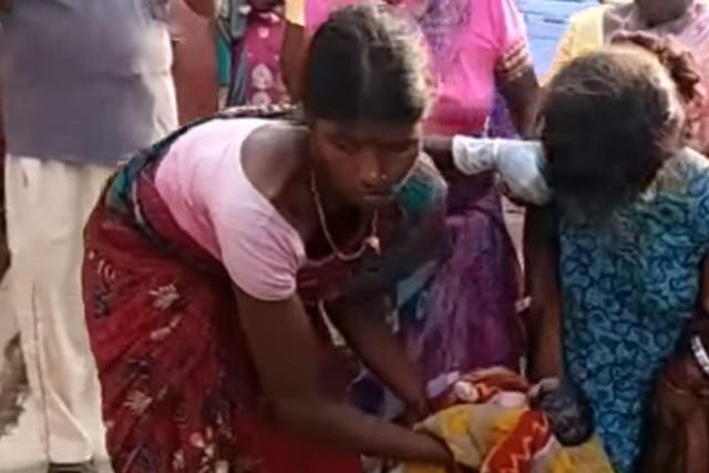 The unnamed girl shortly after giving birth on the street in Chandil, in India's state of Jharkhand
