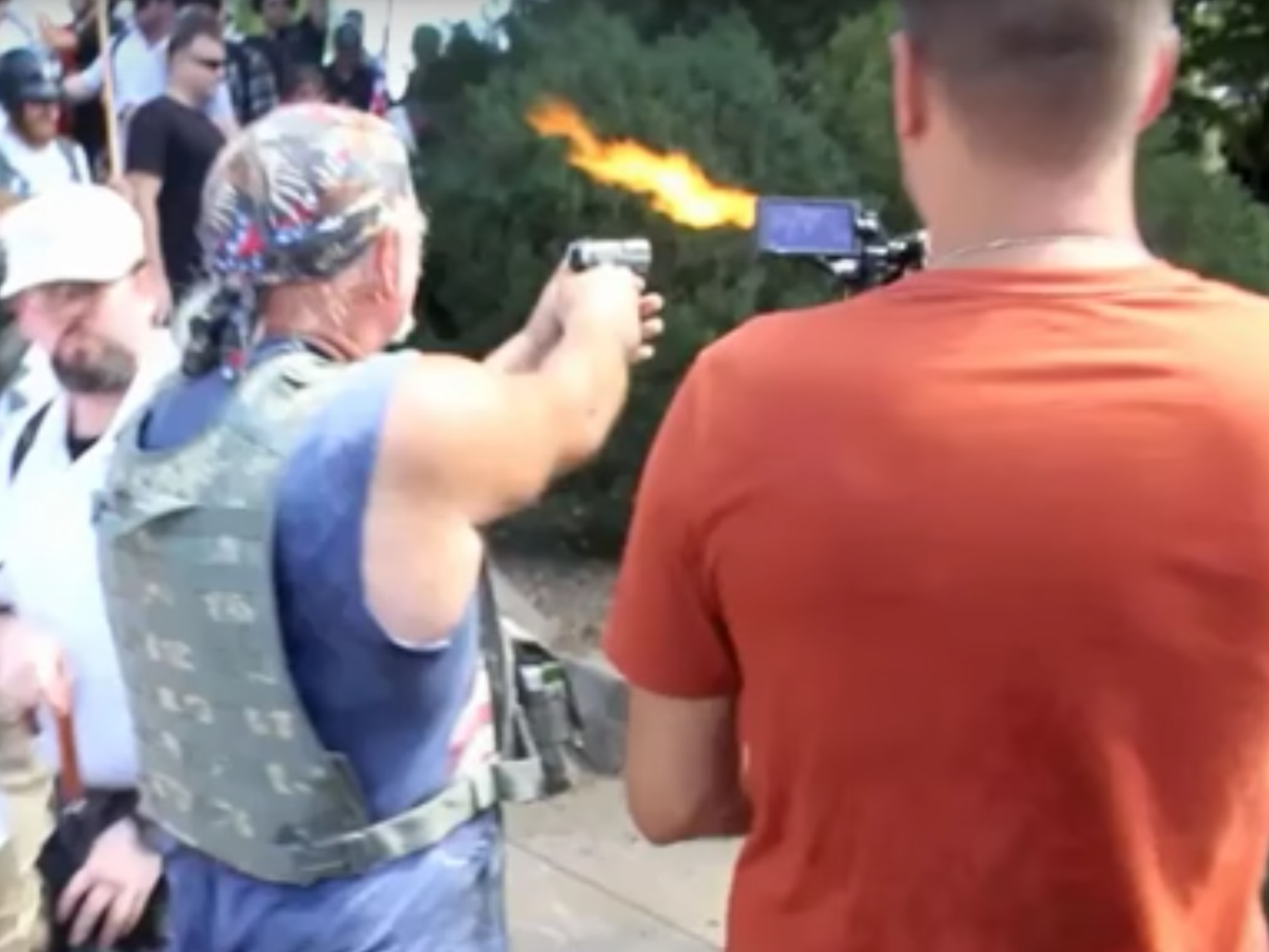 A man identified by police as Richard Wilson Preston points his gun at counter-protestors at a white supremacist rally in Virginia