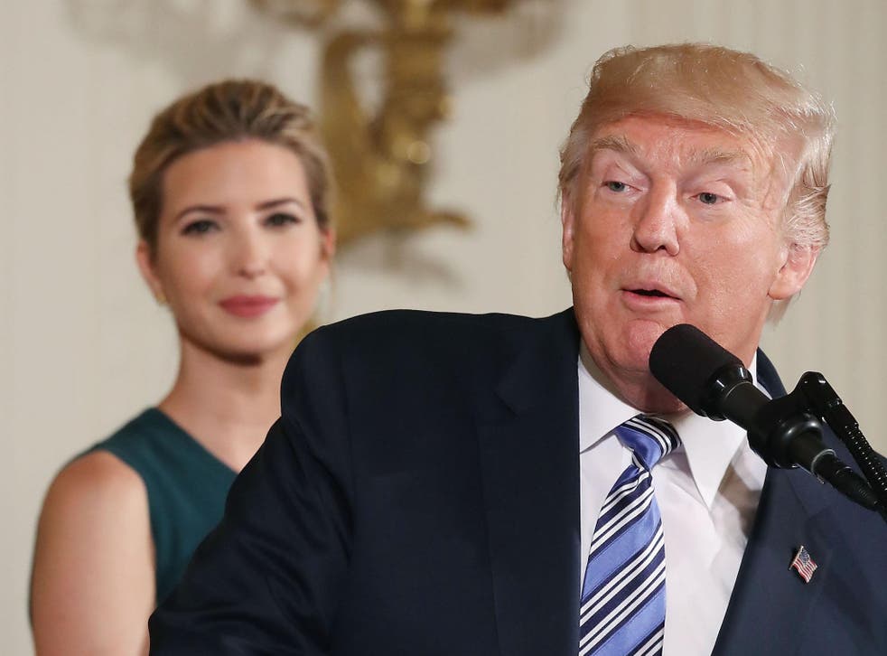 US President Donald Trump speaks about small businesses while daughter and adviser to the President, Ivanka Trump, listens
