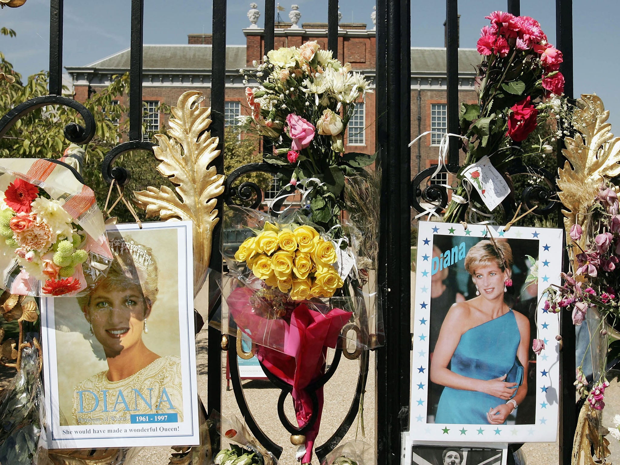 Flowers, photographs and tributes are placed in memory of Princess Diana, Princess of Wales on the gates of Kensington Palace