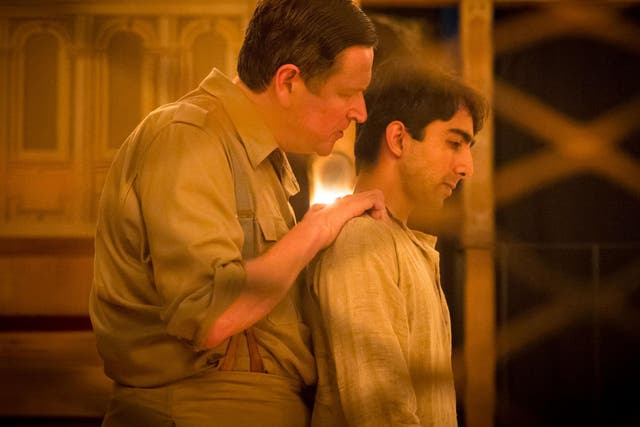 Jonathan Keeble as Executioner and Shubham Saraf as Dinesh Gupta in 'Lions and Tigers' at the Sam Wanamaker Playhouse