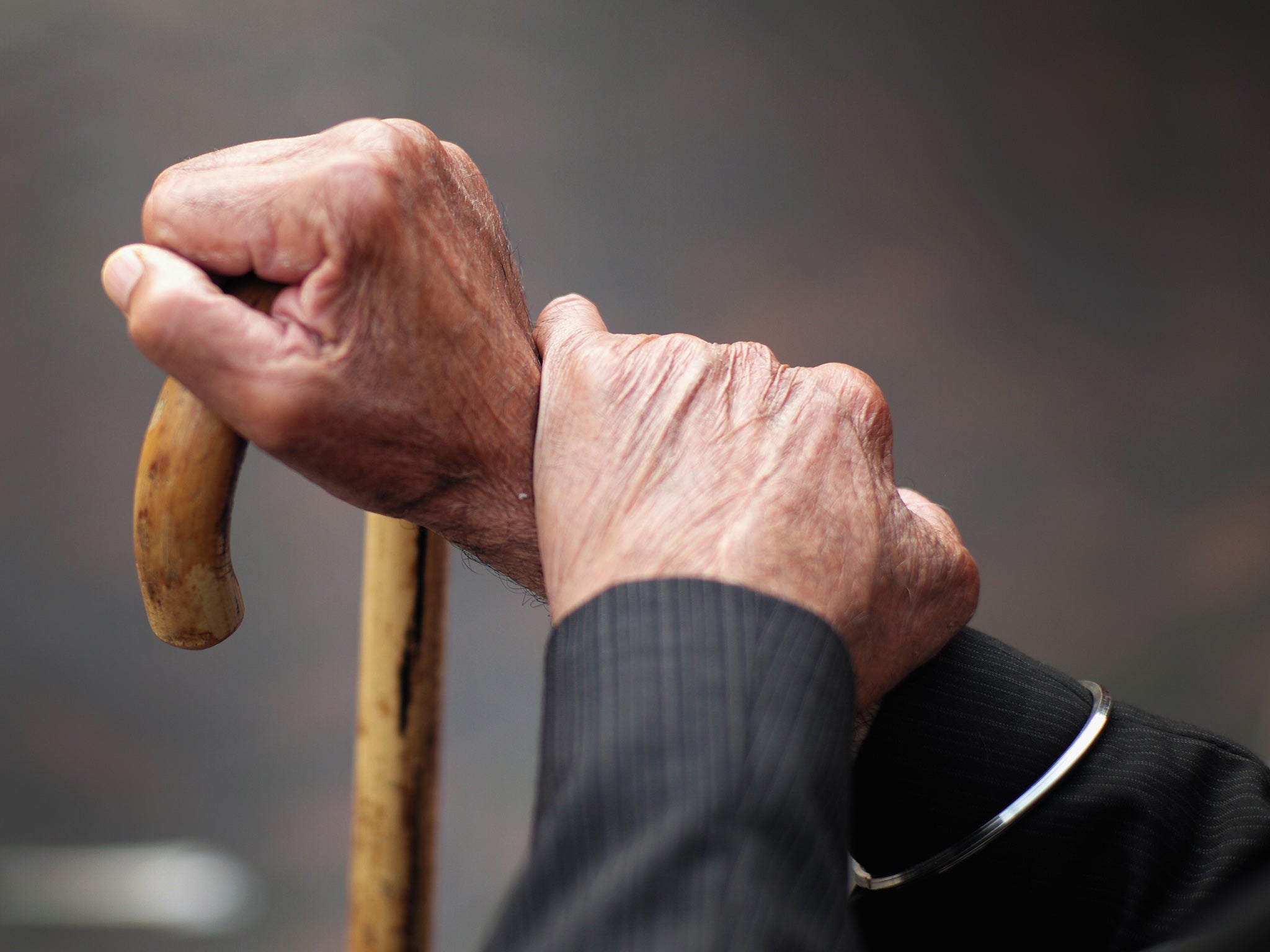 A pensioner holds his walking stick on September 8, 2014 in Walsall