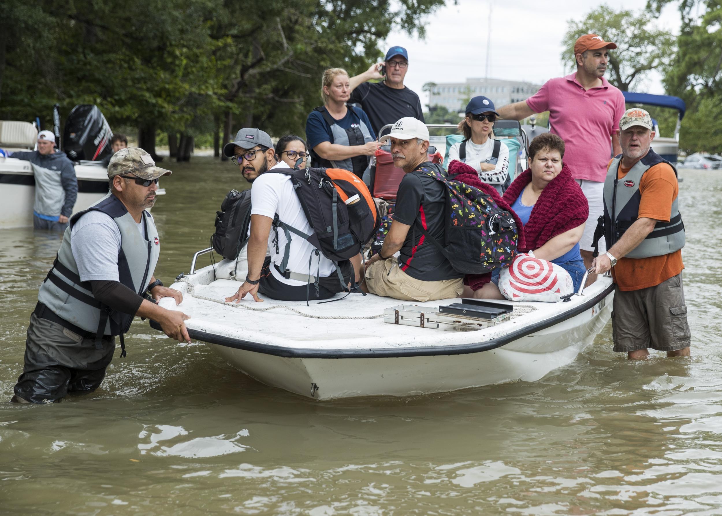 Residents living around the Energy Corridor of west Houston, Texas are rescued from flooded homes and apartments