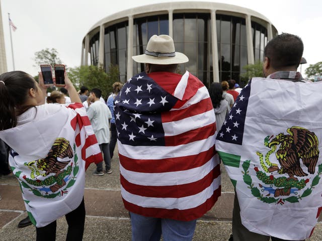 Protesters takes part in a rally to oppose a new Texas "sanctuary cities" bill that aligns with the President's tougher stance on illegal immigration in San Antonio on 26 June 2017