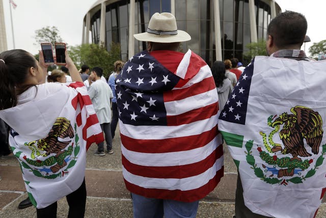 Protesters takes part in a rally to oppose a new Texas "sanctuary cities" bill that aligns with the President's tougher stance on illegal immigration in San Antonio on 26 June 2017