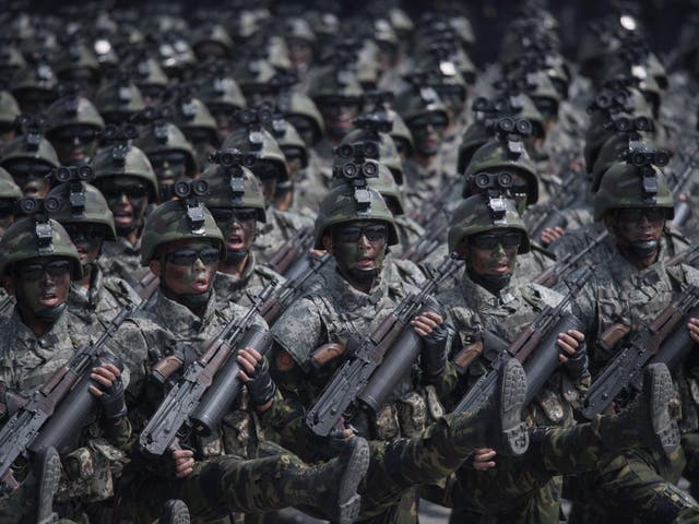 Korean People's Army (KPA) soldiers march through Kim Il-Sung square during a military parade marking the 105th anniversary of the birth of late North Korean leader Kim Il-Sung