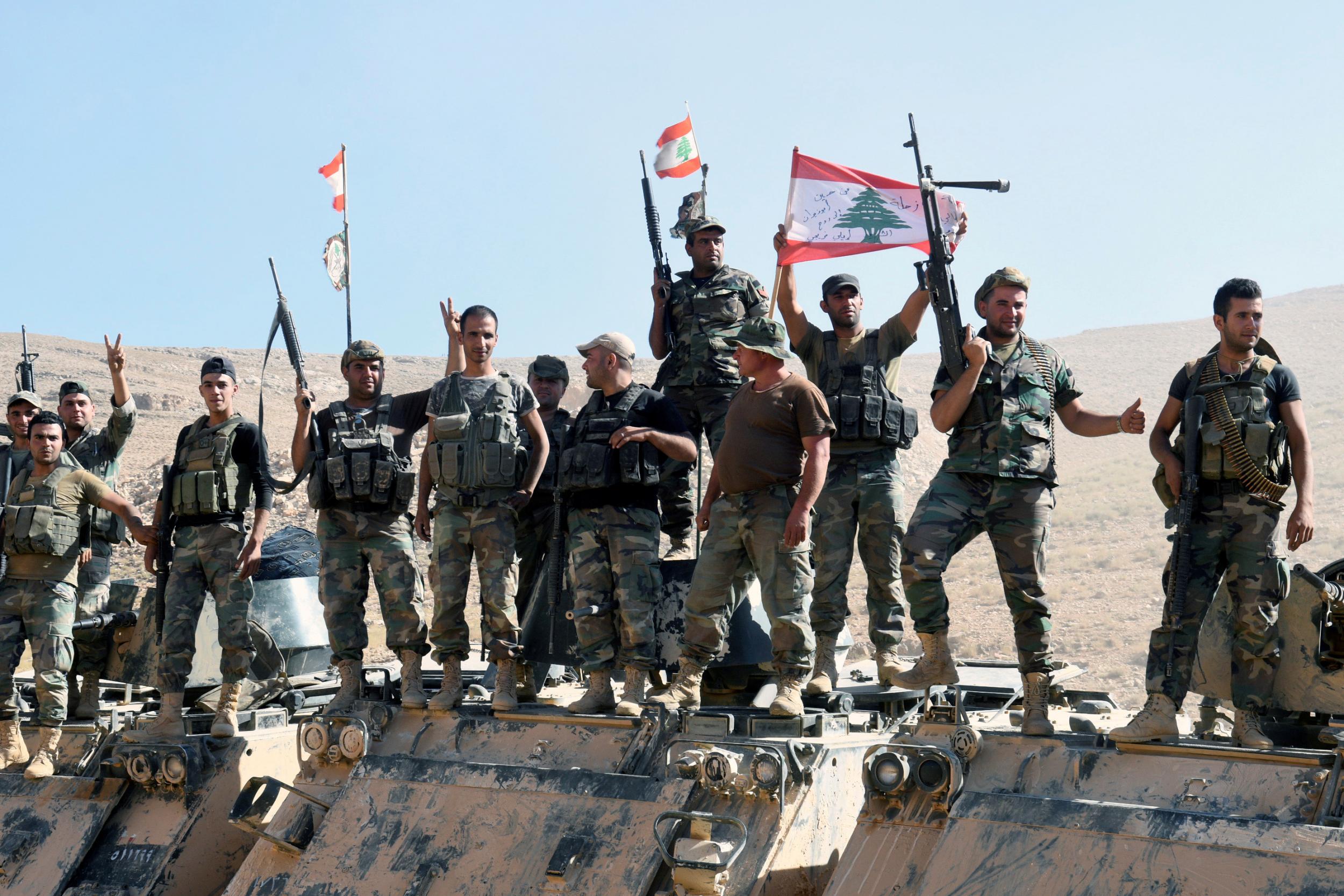 Lebanese Army soldiers flash the victory sign in Ras Baalbek, Lebanon on 28 August 2017
